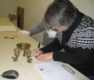 Registrar tagging a Bali artifact. Thanks to Sharon Steckline for the picture.