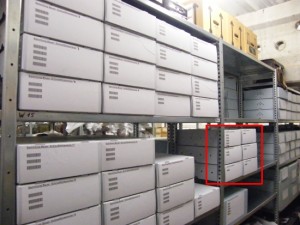 Shelves with repacked narrow film cameras and the six boxes with glass slides (marked red). You can also catch a glimpse of the now empty shelf boards.