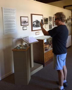  Chuck Dean demonstrates the use of the KNFB Reader app on his iPhone at the Scottsdale Historical Society Museum.
